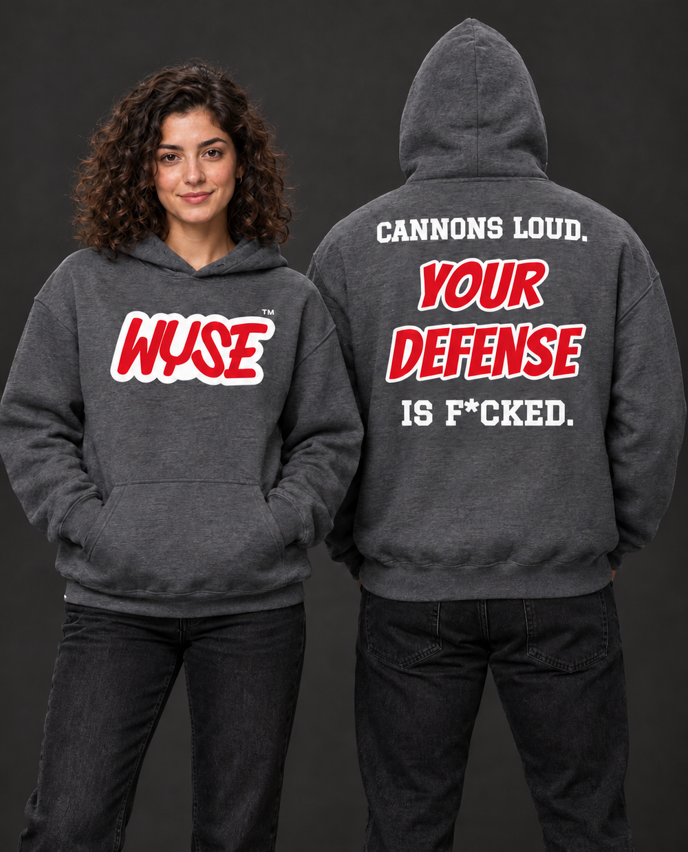 WYSE Tampa Bay Buccaneers fan hoodie in dark heather, woman front and athletic man fully facing away, hood up, compact Cannons Loud back lettering.