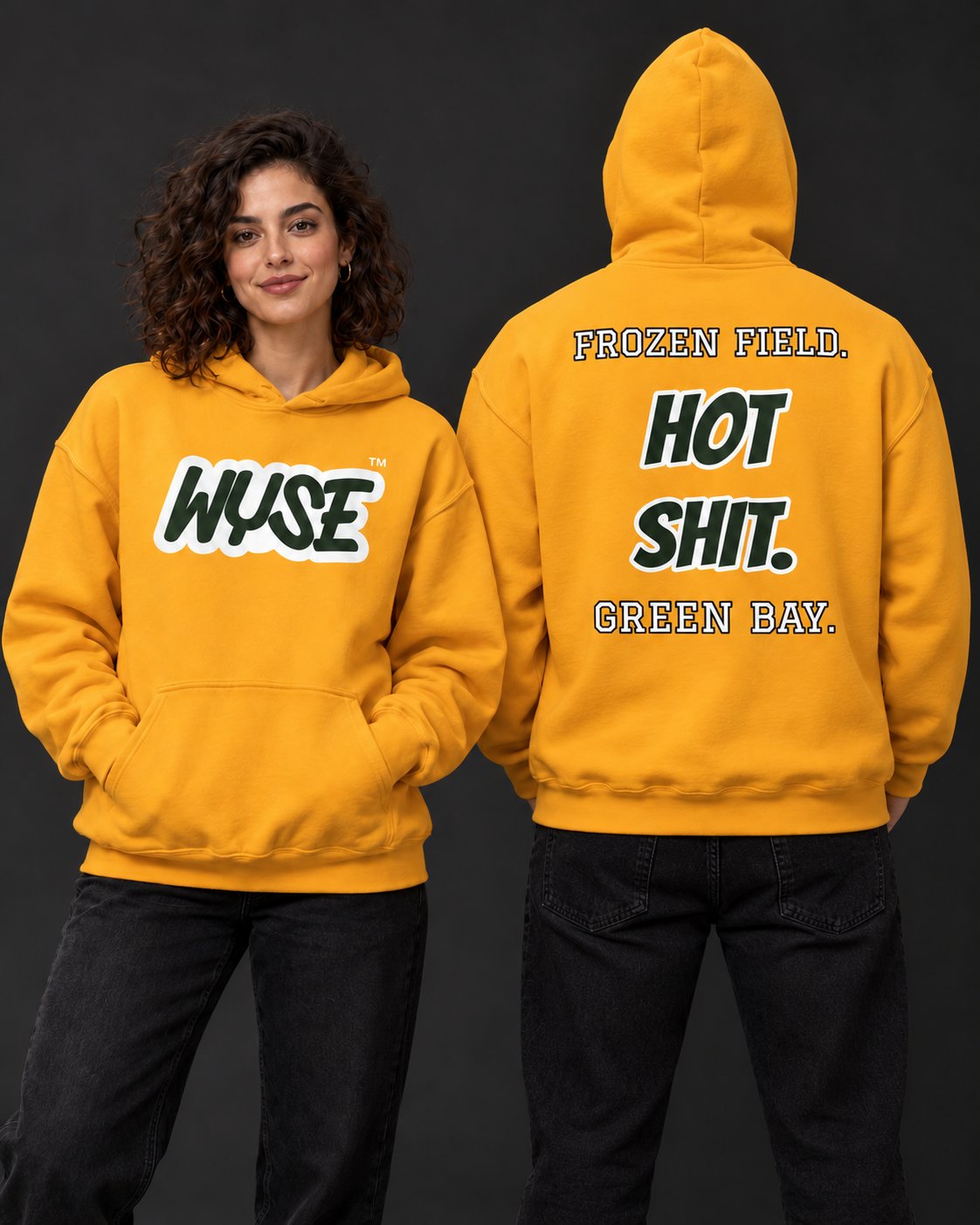 WYSE Green Bay Packers gold fan hoodie, woman front and athletic man fully facing away with Frozen Field Hot Shit Green Bay back print.