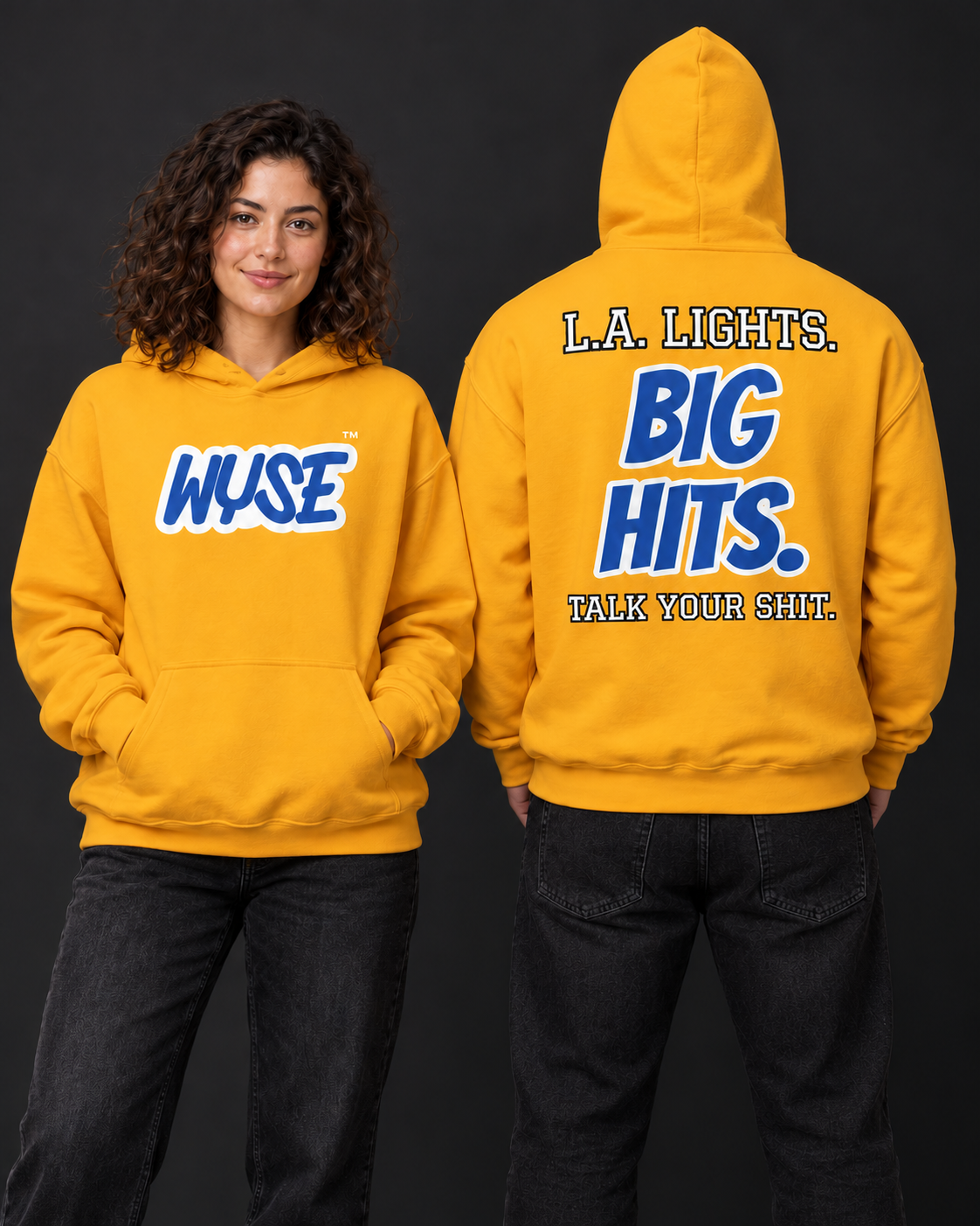 WYSE Los Angeles Rams fan hoodie in gold, woman showing royal WYSE chest logo and athletic man facing fully away showing LA Lights Big Hits back.