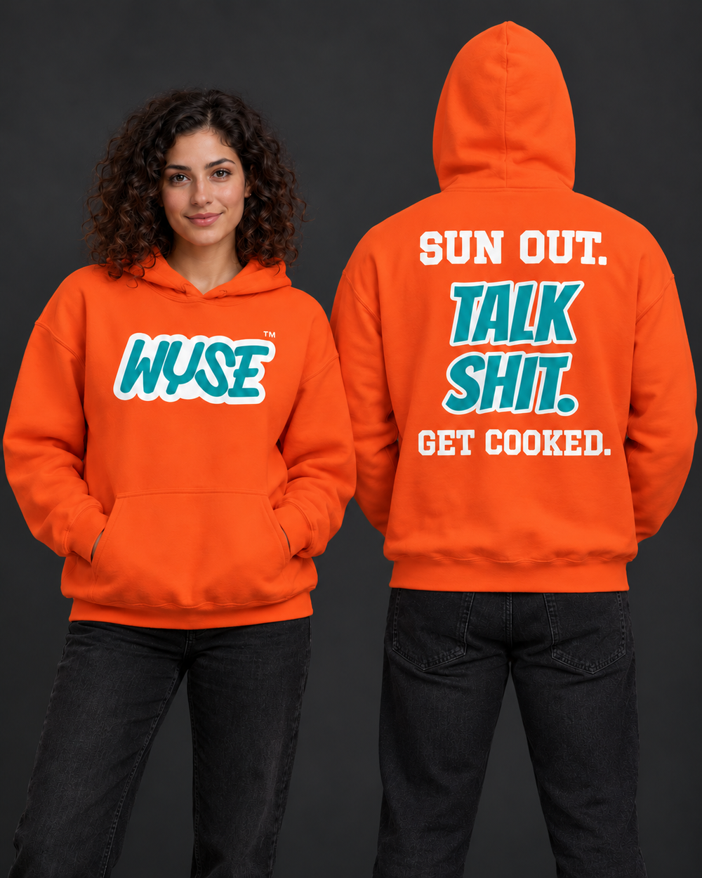 WYSE Miami Dolphins fan hoodie in orange, woman showing aqua WYSE front logo and athletic man facing fully away with the compact Sun Out Talk Shit Get Cooked back.