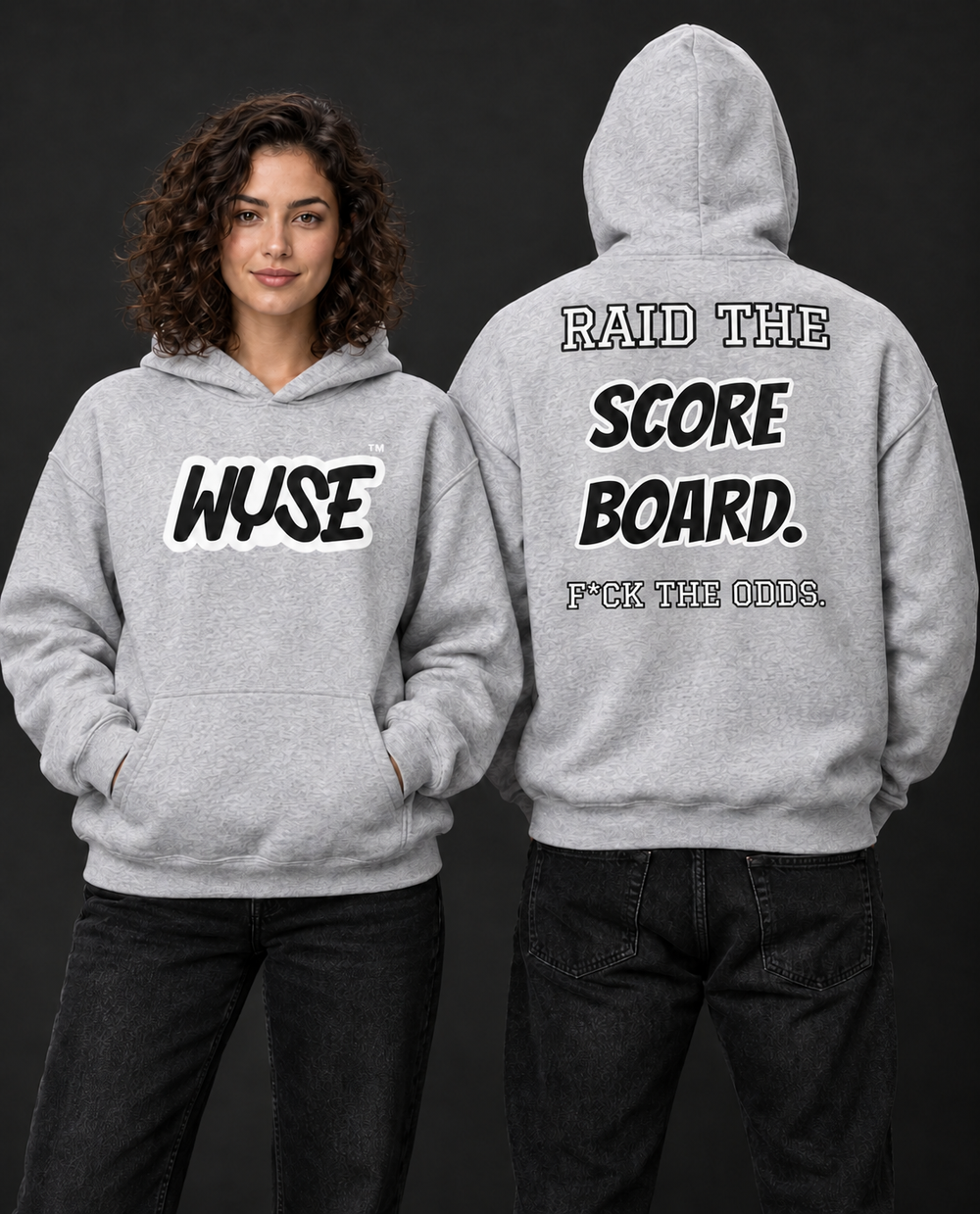 WYSE Las Vegas Raiders fan hoodie in sport grey, woman front and athletic man fully facing away with compact Raid the Score Board back print.